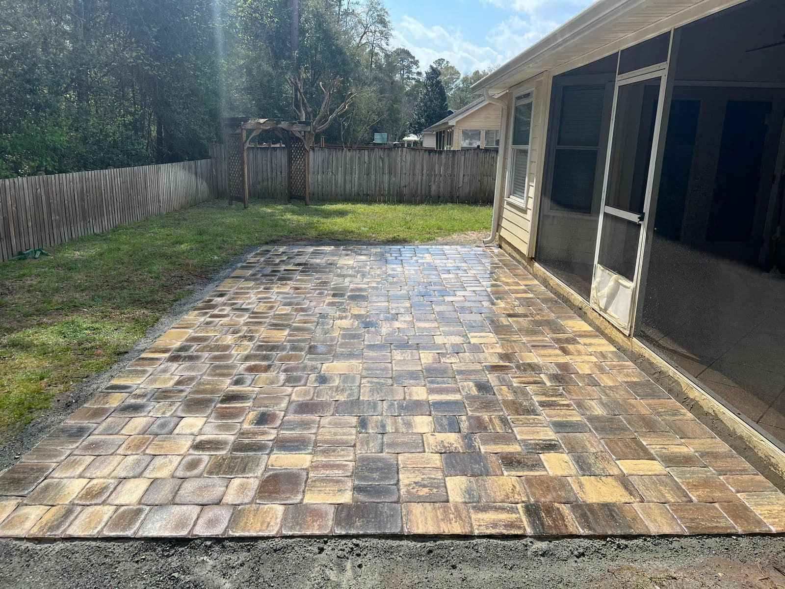 Paver patio extending from an existing slab in Apopka, FL