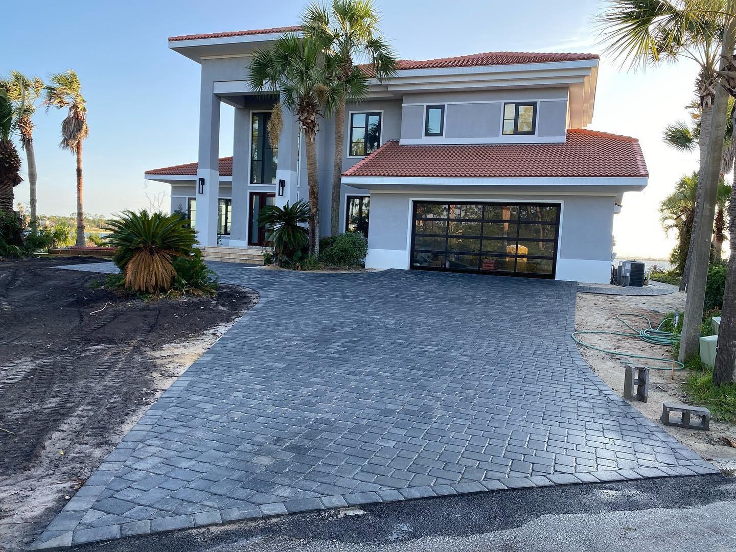 Graded paver driveway on elevated terrain near Clermont, FL