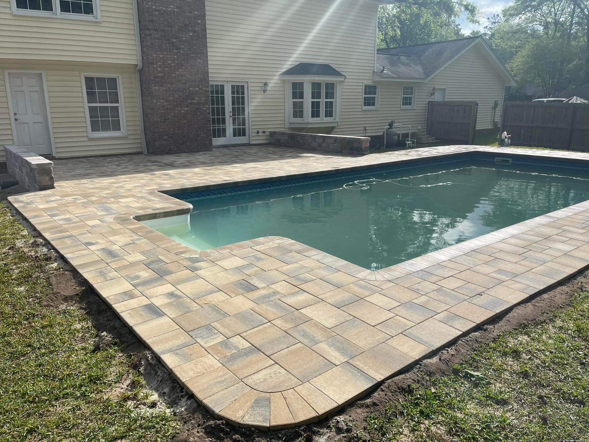 Paver pool deck and fire pit patio in Lake Mary, FL